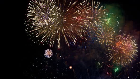 Colorful Firework display at night on sky background alt