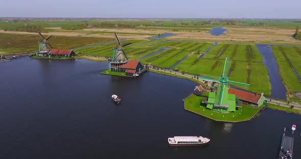 Classic well kept Dutch wooden Windmills in Zaanse Schans, Drone footage.