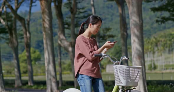 Woman ride a bike in countryside