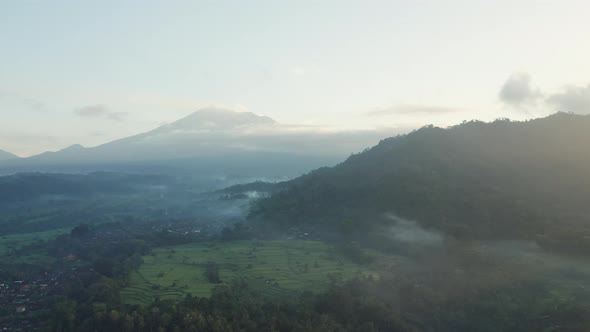 Drone Over Misty Landscape Of Fields