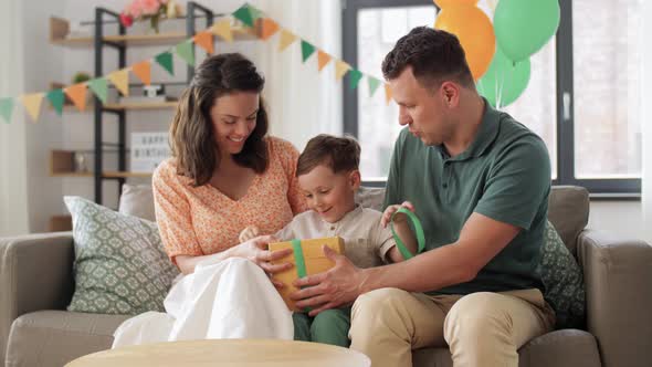 Happy Family Opening Birthday Presents at Home