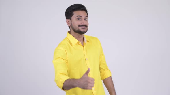 Young Happy Bearded Indian Businessman Giving Thumbs Up