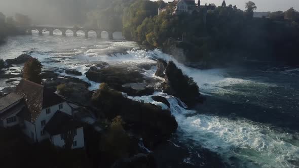 Aerial Revealing Shot Of Rhine Falls In Switzerland Early In The Morning 