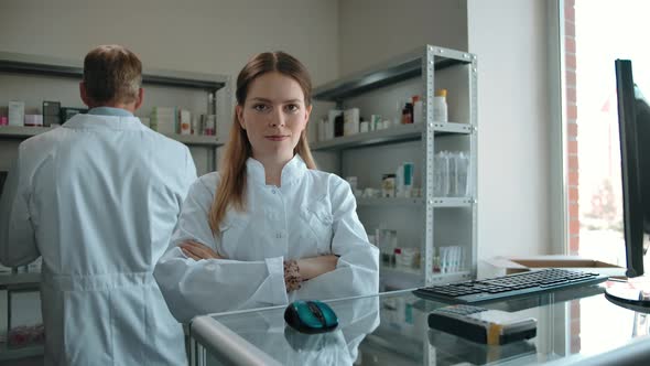 Confident Girl Pharmacist in the Interior of a Modern Pharmacy