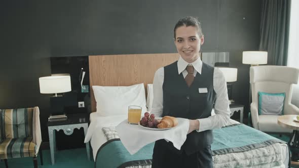 Portrait of Waitress with Breakfast on Tray in Hotel Room