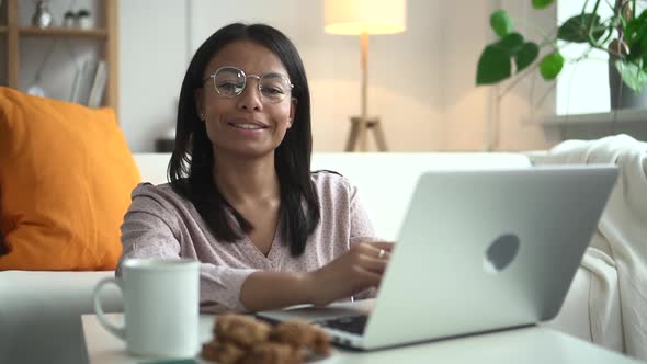 Portrait of Happy African Woman at Laptop in Home Interior Spbd