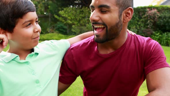 Father and son enjoying in park 4k