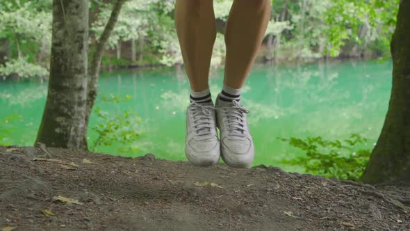 The feet of the jumping rope man. Slow motion video.