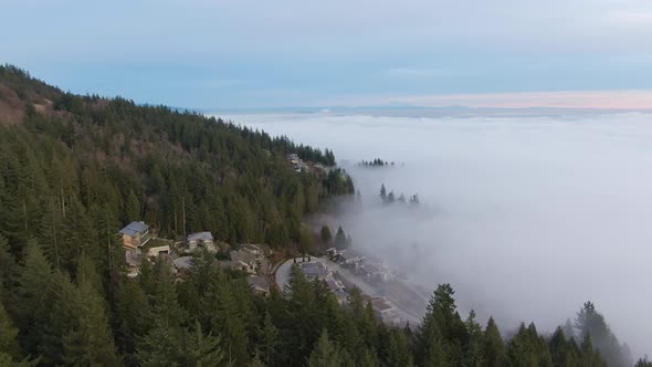 View of Canadian Nature Mountain Landscape covered in cloud and fog. West Vancouver, British Columbi