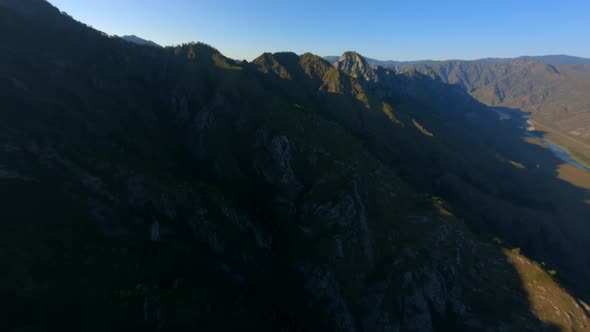 Aerial View Sunset Sunrise Mountain Summit Stone Rocky Texture Covered By Green Plant Trees Grass