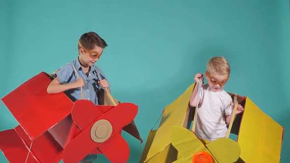 Cheerful Kids Wearing Airplane Boxes