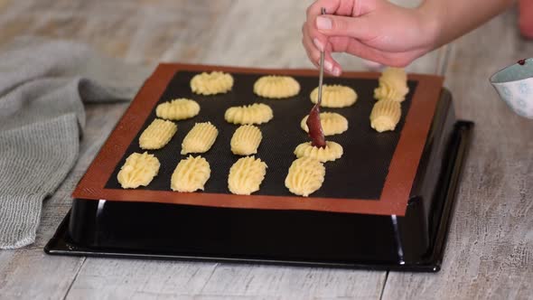 Female Hands a Making Homemade Biscuit Shortbread Cookies with Jam