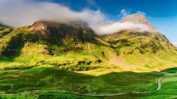 Dawn over the green mountains of Glencoe in Scotland, 4k, timelapse