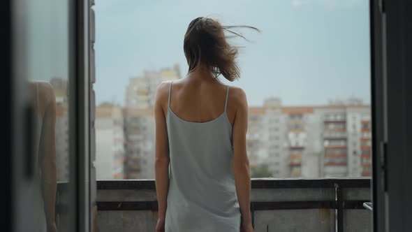 Rear View of a Young Woman Standing on Balcony at Home Slow Motionsocial Distancing and Self