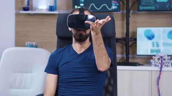 Man Wearing Virtual Reality Goggles in a Neuroscience Laboratory