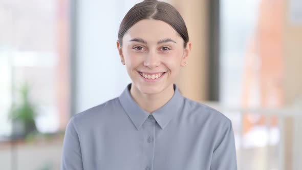 Portrait of Attractive Young Latin Woman Smiling at Camera