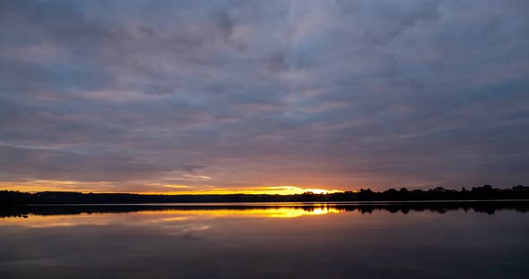 Sunset On The Lake With Pink Clouds