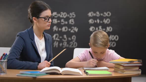 Strict Teacher Hitting Schoolboy With Ruler, Corporal Punishment, Breaking Rule