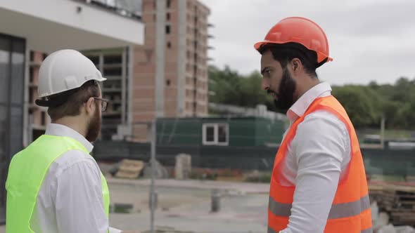 The Builder and Architect Man Are Discussing the Construction Plan of the Modern Business Center