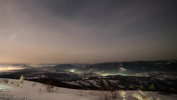 Snow Covered Mountain in Winter Sky View and Snowfall Sky Changing From Yellow Hues at Dawn to Blue