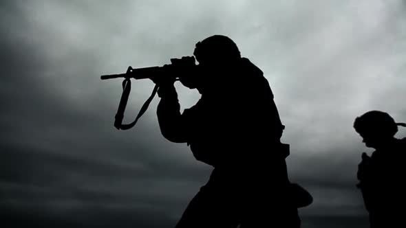 Soldiers silhouette at shooting range