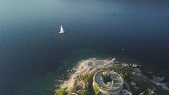 Aerial view of  island with an abandoned fortress in the middle of the sea in Montenegro.