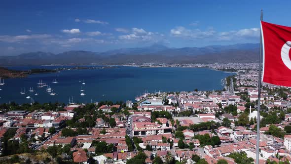 Aerial View of Bay in Fethiye Turkey with Swimming Yachts and Ships in Front of the City