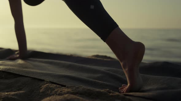 Sporty Woman Feet Exercising on Sand Closeup