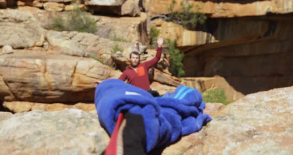 Mountaineer walking on the rope