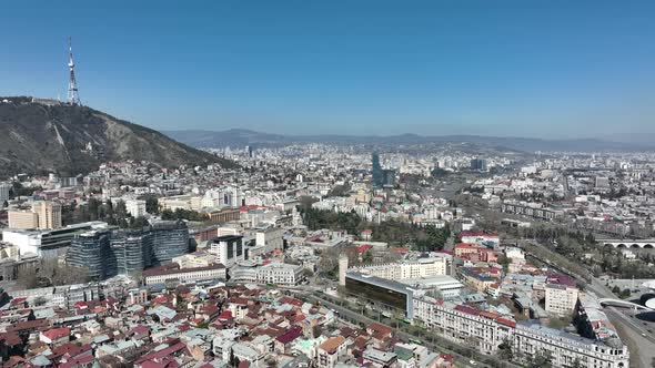 Aerial view of center of Tbilisi under Mtatsminda mountain, Georgia 2022 spring