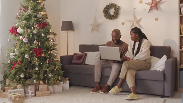 African-American Couple Using Laptop at Christmas