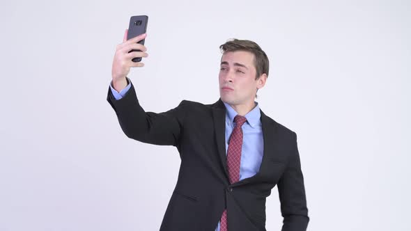 Young Handsome Businessman Taking Selfie