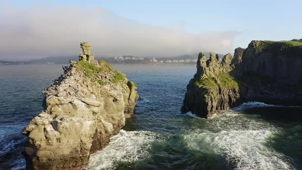 A Bird's Market on a Rocky Ledge in the Shape of Fingers on the Seashore