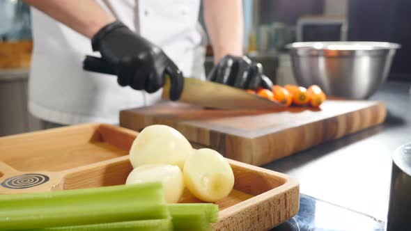 Chef Uses Knife to Cut Carrots