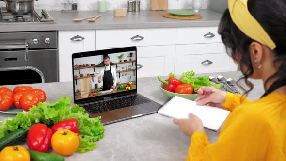 Man Chef Food Blogger in Laptop Computer Screen Greets Tells Teaches Housewife