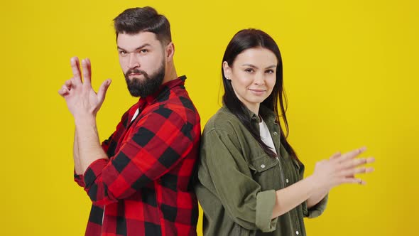 Excited Funny Young Couple Two Friends Man Woman Stand with Their Backs to Each Other and Make