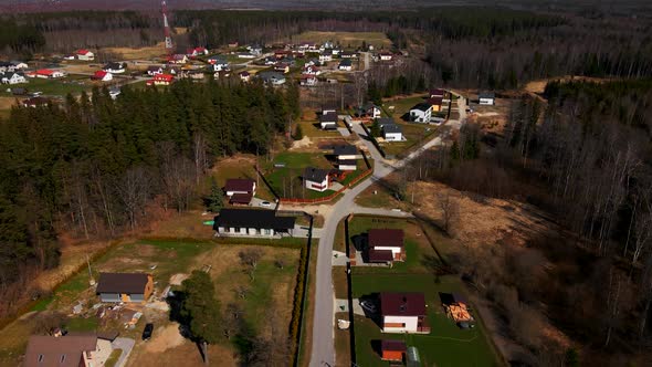 Flying Over Residential Houses with Cellular Tower in Centre in European Settlement