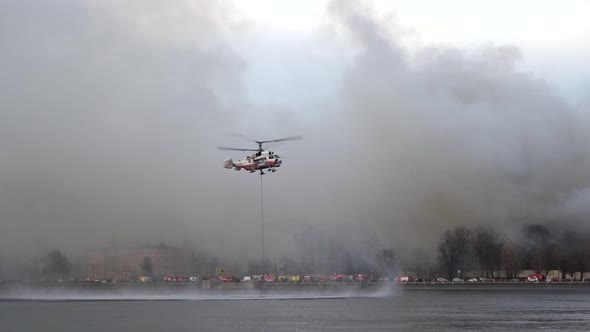 Helicopter Picks Up Bambi Bucket From River