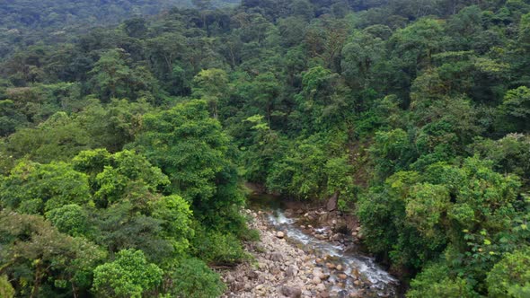 Aerial view, following a mountain river in the Andes that is meandering