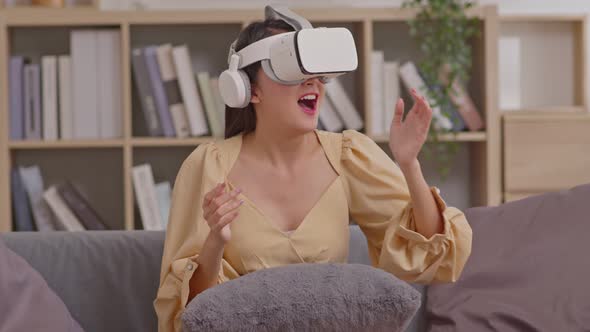 Asian lady wears VR headset having fun experience wearable virtual reality digital innovation techno