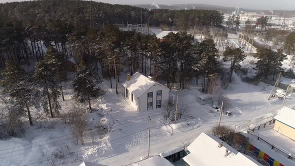 Aerial view of new white modern residential house at winter near the forest 10