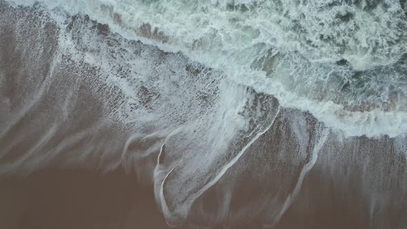 Overhead Shot Of Beautiful Waves Crashing On Sandy Beach, Portugal