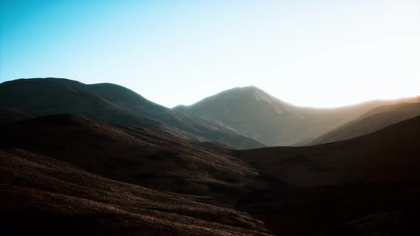 Hills with Rocks at Sunset