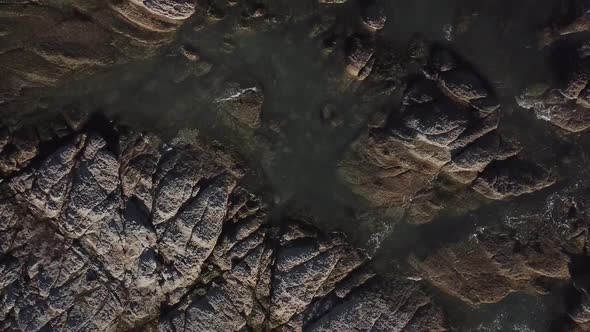 Top-down view of rocks on the shore