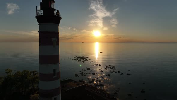 Aerial View of a Beautiful Sunrise or Sunset Behind the Dome and the Light of the Lighthouse of the