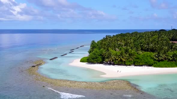 Aerial drone panorama of coastline beach journey by clear lagoon with sand background