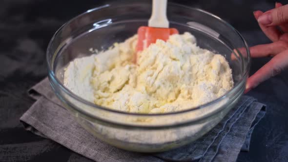 Kneading shortbread dough in the glass bowl