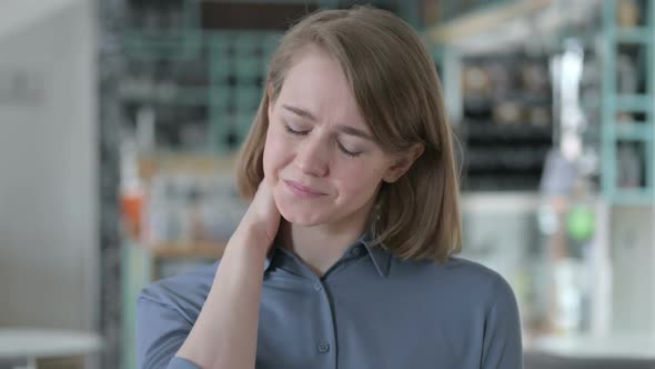 Portrait of Young Woman Having Neck Pain