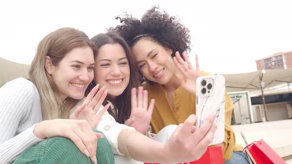 Three Diverse Young Women Making a Video Call on the Street