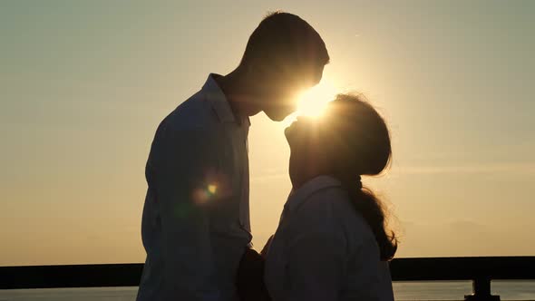 Disabled Couple Enjoys Time Together at Back Sunset Light